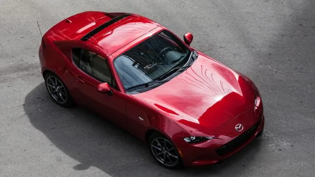 The hardtop version — RF, or retractable fastback — opens and closes quickly, and makes the interior quieter at speed. It will add about $2,000 to the price versus a comparable soft-top MX-5. (Mazda photo)