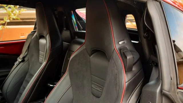 The stock seats are good. And then you can add Recaro seats. Both have embedded Bose speakers in the head restraints, to improve top-down listening. A BBS/Brembo/Recaro package runs $4,670. (Mazda photo)