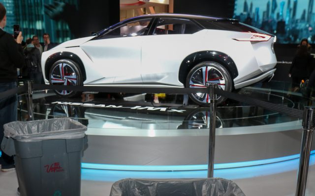 The Nissan IMX concept car shares the Nissan booth with strategically placed trash cans. In a convention center with 2 million square feet of exhibition space, raindrops find their way through the roof here and there.