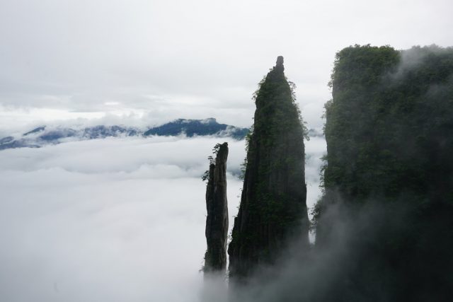 Limestone towers, known as karst formations, rise out of the mist in Enshi Grand Canyon National Park, China. (Credit: National Geographic)