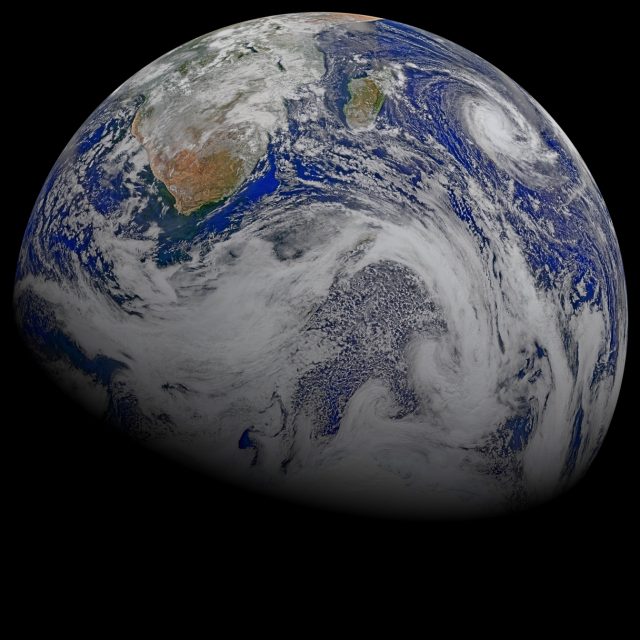 Data from six orbits of the Suomi-NPP spacecraft are assembled into this perspective composite of southern Africa and the surrounding oceans. Tropical Cyclone Joalane can be seen over the Indian Ocean on April 9, 2015. (Credit: Ocean Biology Processing Group, NASA’s Goddard Space Flight Center)