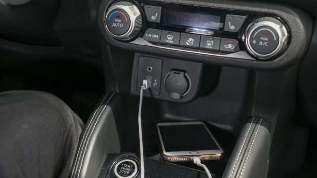 The Nissan Kicks center stack includes a dedicated climate control panel, a USB jack, a line-in jack, and a 12-volt socket. Wireless charging is not offered.