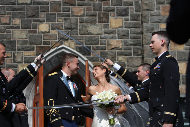 To avoid getting in the way of the wedding party, stand back with a long lens and frame the photo. It never hurts when the bride and groom are photogenic.