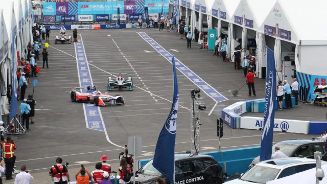 Drivers duck into and out of the paddock, off pit road, to change cars midway through the race. Next season, a bigger battery will allow a single car to last the whole race. (Credit: Bill Howard)