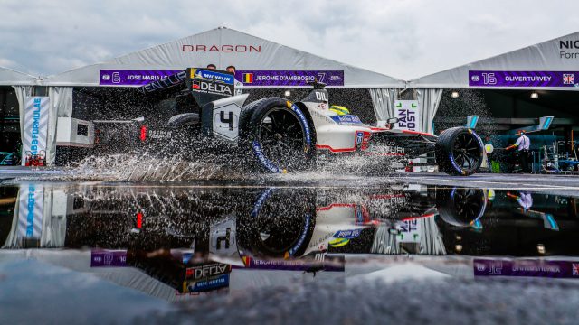 Driver Tom Dillman, in Venturi&#039;s Formula E car, splashes his way to the track. The weekend went from heavy rain to weather alert (track closed, fans and workers moved indoors), and then to sunshine. (Credit: Motorsport Images) 