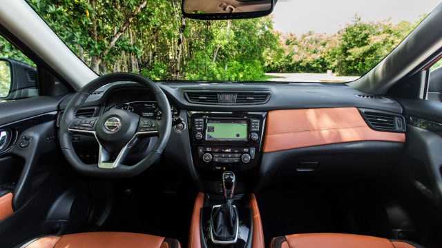 The Rogue SL, the top trim line, offers three leather choices: charcoal, almond, and (here) an attractive rich tan. The cockpit is nicely finished.