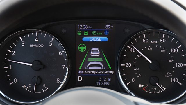 Close-up of the instrument panel with a color multi-information display flanking the tachometer and speedometer.