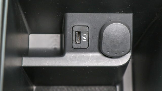 The smallish center console holds the car&#039;s second USB jack. This was added for 2018. If a front seat passenger uses this USB port, the two or three passengers in the back must fight for the cargo bay&#039;s 12-volt accessory socket and hope they brought a USB adapter.