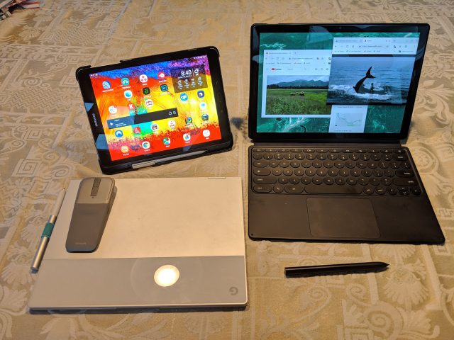 The Slate (right) is larger and heavier than a 10-inch Android tablet like the Galaxy S3, but smaller and lighter than the clamshell-design Pixelbook.