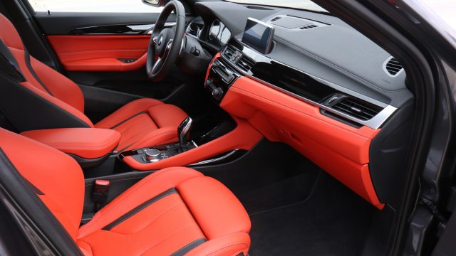 For the longest time, German automakers gave you black cockpit trim, black leather, or black vinyl seats, with maybe the option of beige. Now, behold the X2 M35i&#039;s orange upholstery. On a small, fun car, it looks great. 