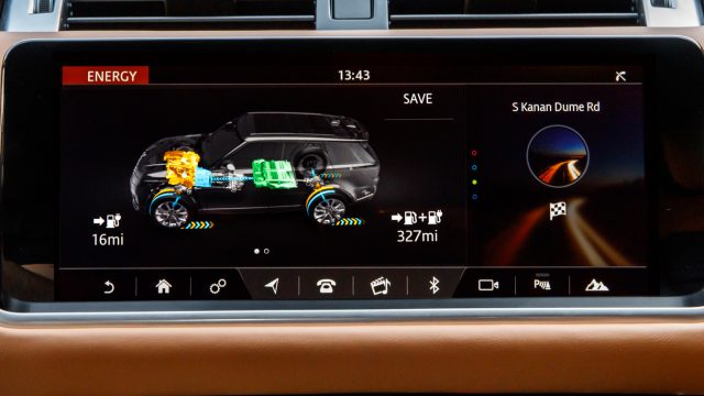 The top LCD on the center stack provides charge and propulsion status: battery, combustion, or both. 