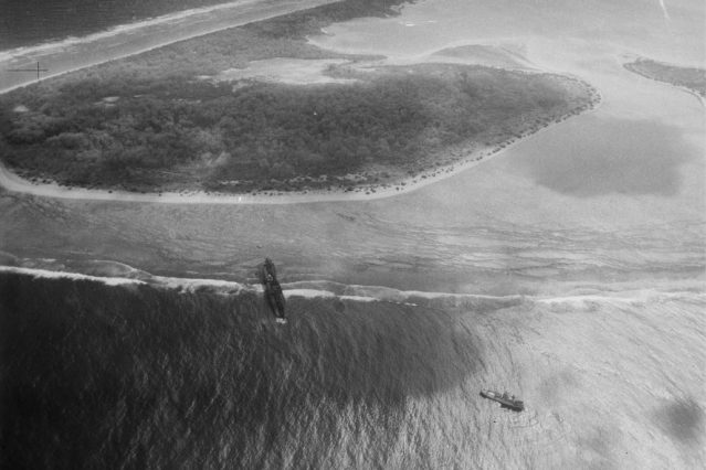 Gardner Island in 1938. The wreck of the steamer Norwich City is clearly visible on the atoll. Click to enlarge, Ctrl-Click to enlarge in a separate window. 