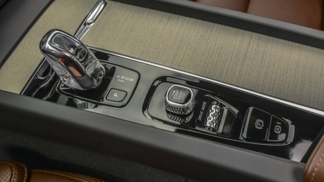 Volvo consoles have a crystal start-stop knob, a silvery drive modes roller, and (on some trim levels) a shifter in crystal.