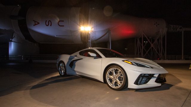 The hardtop Corvette coupe, introduced in July, under the Saturn 18 rocket at Kennedy Space Center.