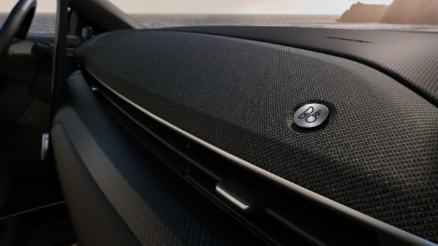 B&O provides the upgrade audio. Dashboard speakers are covered in traditional speaker cloth.