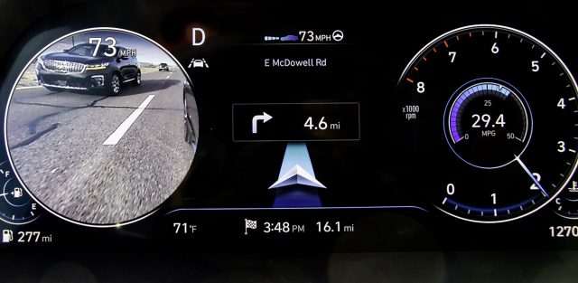 Hyundai blind spot sensors are backed up by side/rear-facing cameras. Flick the turn signal and the speedometer (left side) or tach is replaced by an over-the-shoulder video kind of view. Very slick.